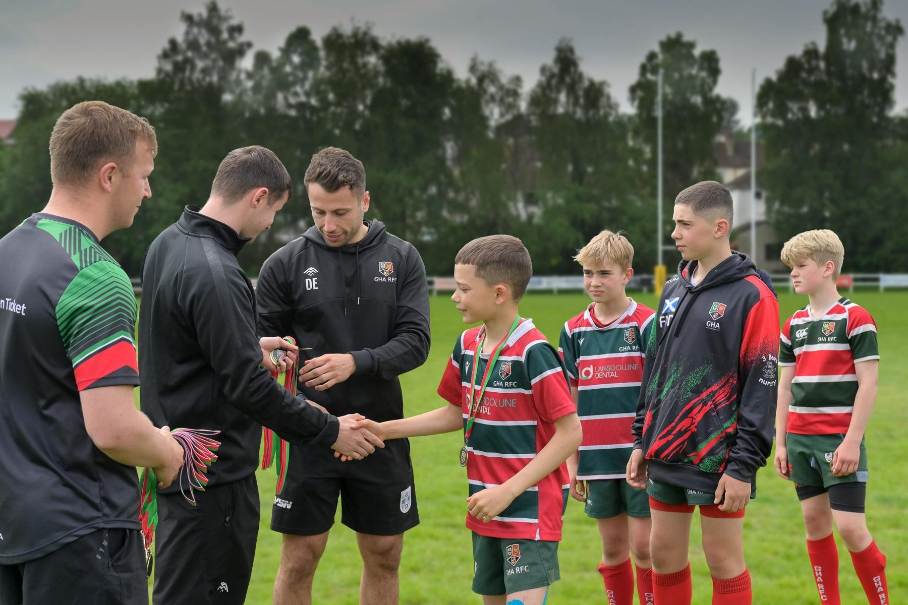 GHA players packing down in a scrum during a match