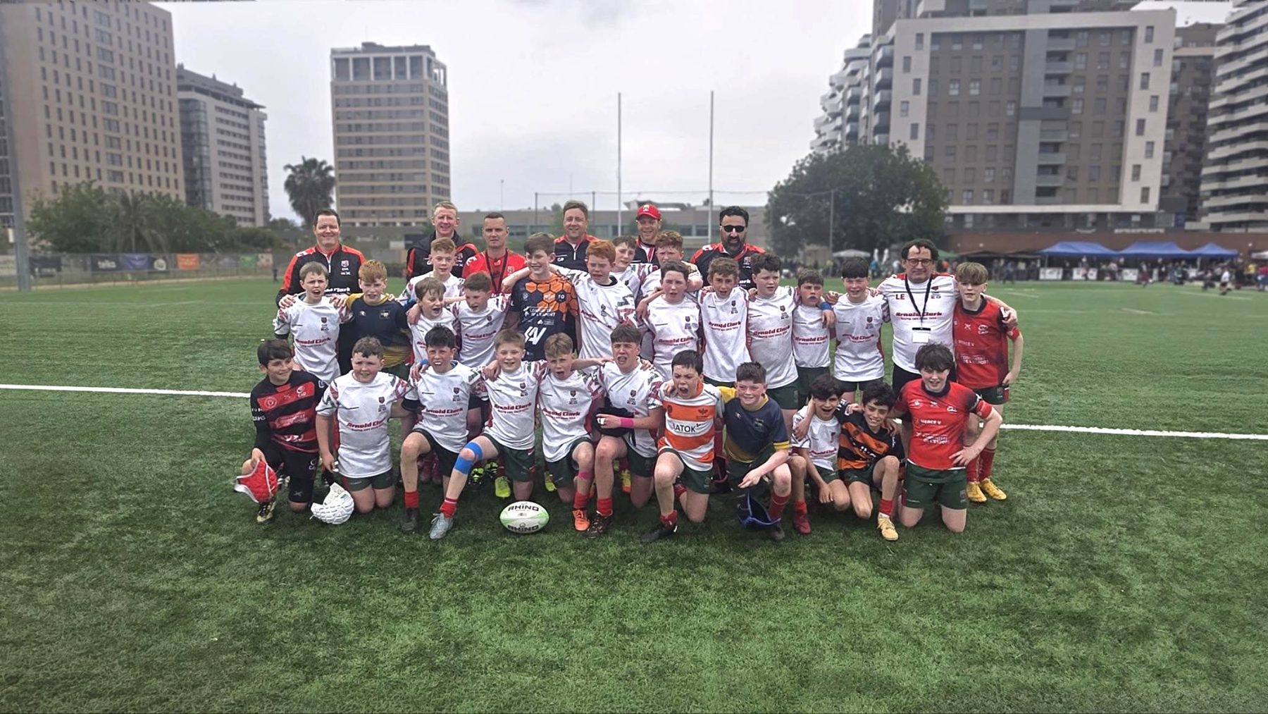 A full GHA squad team photograph on the pitch