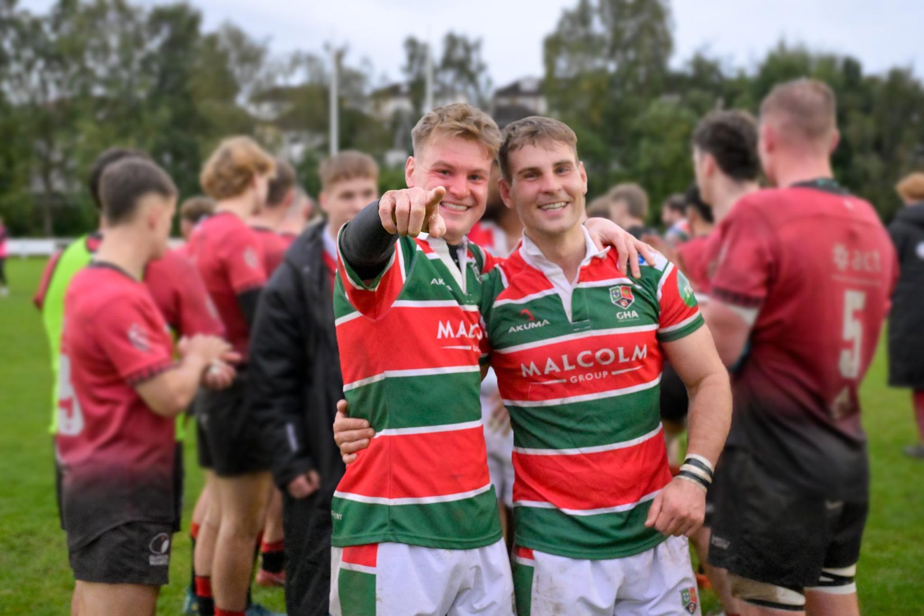GHA Rugby players and coaches celebrating a win together